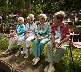 Photo of four women talking