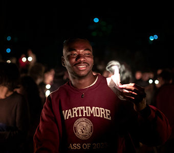 Student with a candle. Links to Gifts of Cash, Checks, and Credit Cards Student with a candle. Links to Gifts of Cash, Checks, and Credit Cards