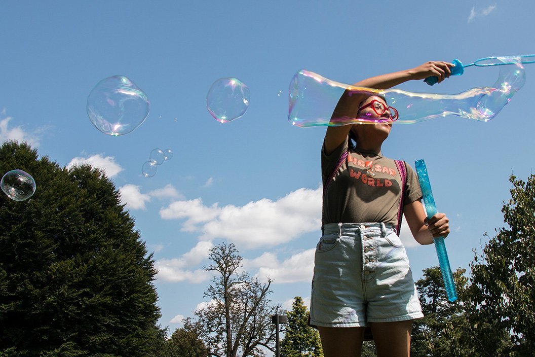 student making bubbles